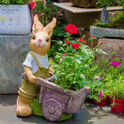 公園景區(qū)玻璃鋼彩繪推著花盆車的兔子雕塑